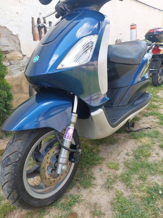 Piaggio  125 ..și un kymco 125