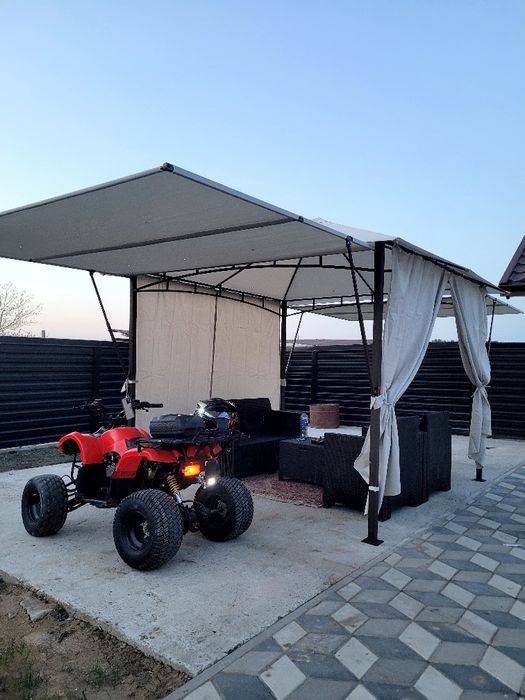 Vând atv 125cc rosu cu negru