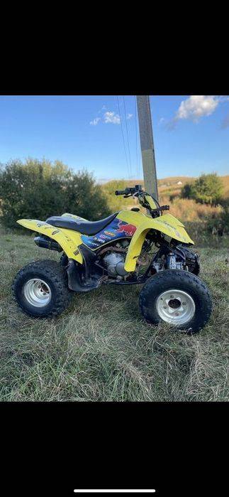 Vand  ATV suzuki  sau schimb cu masina 7 locuri